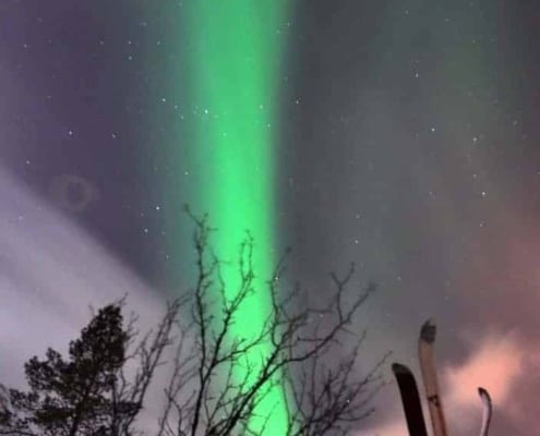 Northern Lights between the skis