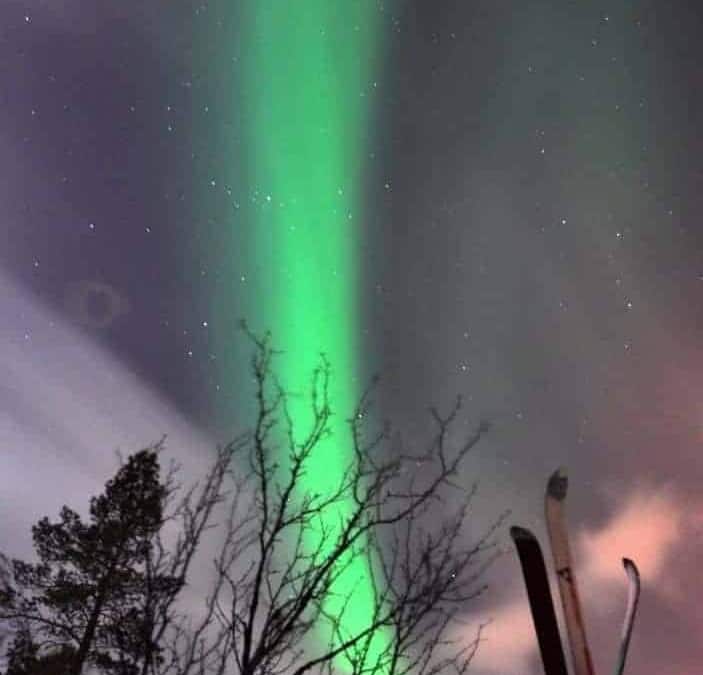 Northern Lights between the skis