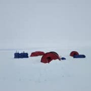 Tent and equipment prepared for storm on Greenland expedition.